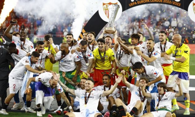 Sevilla celebrates with the trophy after winning the Europa League REUTERS/John Sibley