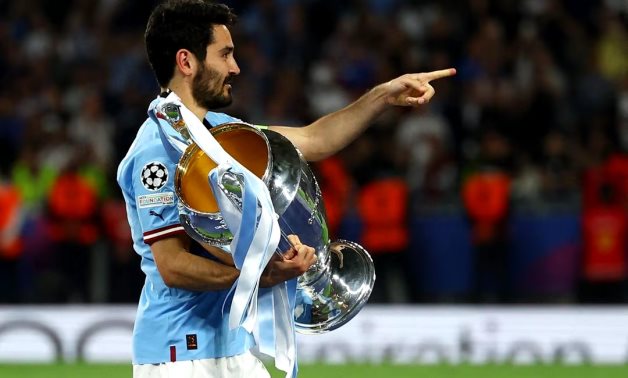 Manchester City's Ilkay Gundogan celebrates with the trophy after winning the Champions League REUTERS/Molly Darlington/File Photo