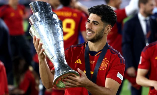 Spain's Marco Asensio celebrates with the trophy after winning the UEFA Nations League final REUTERS/Yves Herman/File Photo