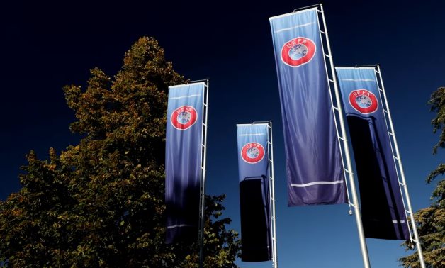 Flags with UEFA logo are seen outside of the Union of European Football Associations headquarters in Nyon, Switzerland, October 5, 2022. REUTERS/Denis Balibouse/File Photo