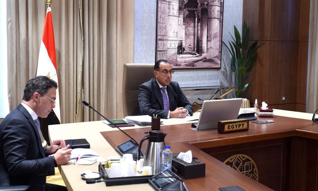 Egypt’s Prime Minister Moustafa Madbouli delivers a speech on behalf of President Abdel Fattah El Sisi during a virtual meeting of CAHOSCC - Cabinet