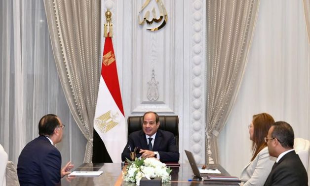 File - President Sisi holding a meeting with the Prime  Minister Mustafa Madbouly 
