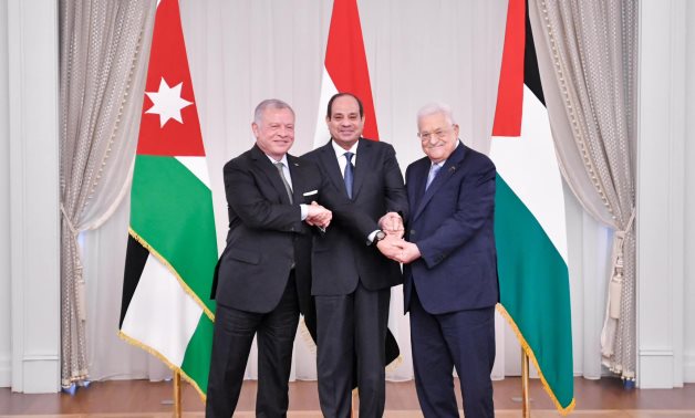 Egypt’s President Abdel Fattah El-Sisi, Jordan’s King Abdullah II and Palestinian President Mahmoud Abbas shake hands as they hold a trilateral summit in Alamein, Egypt – Egyptian Presidency
