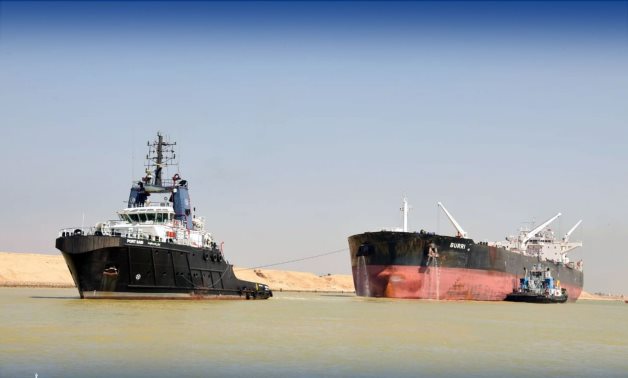 A SCA tugboat towing tanker Burri out of the Suez Canal to restore traffic in the waterway. SCA