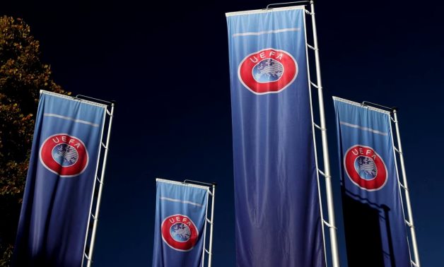 Flags with UEFA logo are seen outside of the Union of European Football Associations headquarters in Nyon, Switzerland, October 5, 2022. REUTERS/Denis Balibouse/File Photo