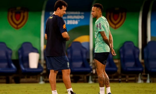 Brazil's Neymar talks with interim coach Fernando Diniz during training REUTERS/Adriano