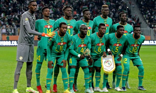 Senegal players pose for a team group photo before the match REUTERS/Ramzi Boudina/File Photo