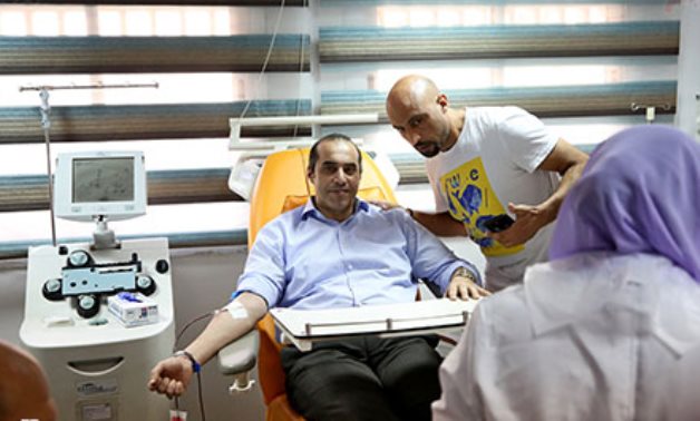 Judge Mahmoud Fawzi, head of the official campaign of presidential candidate Abdel Fattah El-Sisi donated his blood- press photo