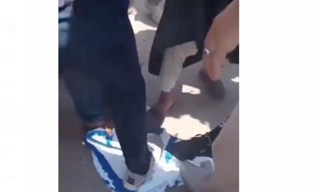 A group of Egyptian students burned the Israeli flag in a protest 
