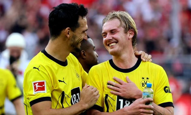 Borussia Dortmund's Julian Brandt and Mats Hummels celebrate after the match REUTERS/Wolfgang Rattay/File Photo