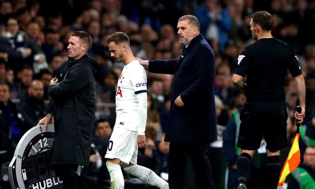 Tottenham Hotspur's James Maddison with manager Ange Postecoglou as he substituted after sustaining an injury Action Images via Reuters/Matthew Childs