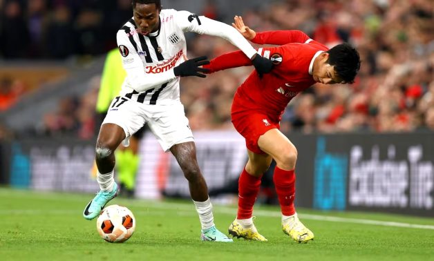 Liverpool's Wataru Endo in action with LASK Linz's Moses Usor REUTERS/Molly Darlington