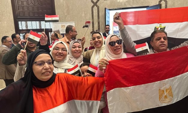 Vibrant scenes of patriotic participation as Egyptian expatriates in Saudi Arabia join the second day of overseas voting - Press Photo