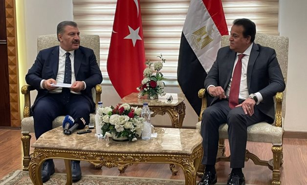 FILE - Egypt’s Minister of Health Khaled Abdel Ghaffar and his Turkish counterpart, Minister Fahrettin Koca, meet in Cairo in mid-November