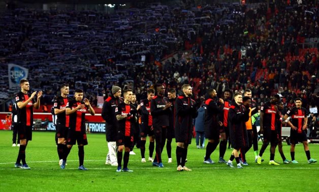 Bayer Leverkusen players celebrate in front of fans after the match REUTERS/Thilo Schmuelgen