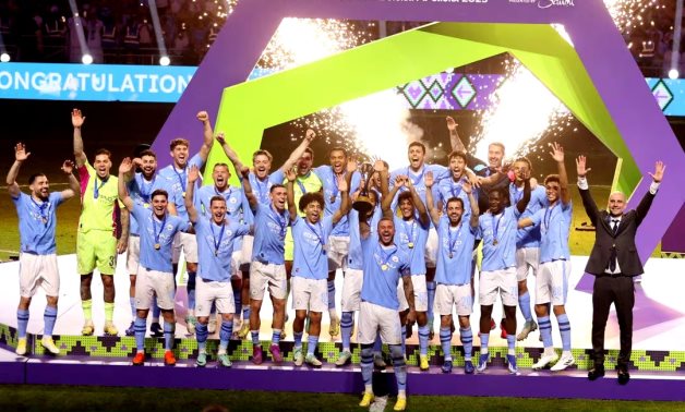 General view as Manchester City's Kyle Walker lifts the trophy alongside teammates after winning the Club World Cup final REUTERS/Ahmed Yosri