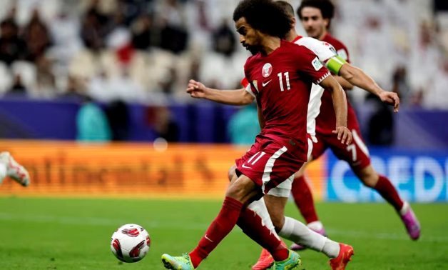 Qatar's Akram Afif scores their third goal REUTERS/Thaier Al-Sudani