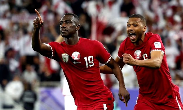  Qatar's Almoez Ali celebrates scoring their third goal with Abdulaziz Hatem REUTERS/Molly Darlington 