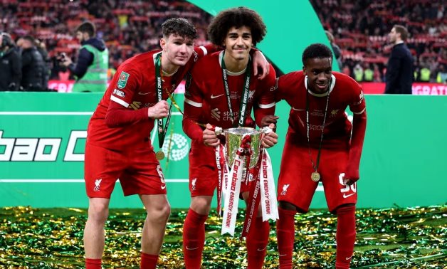 Liverpool's Lewis Koumas, Jayden Danns and Trey Nyoni celebrate winning the Carabao Cup with the trophy REUTERS/Hannah Mckay/ File Photo