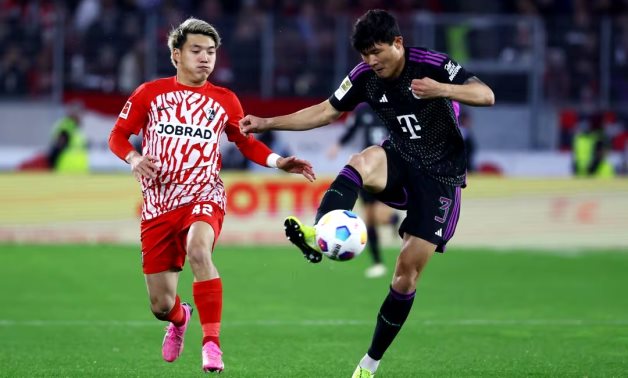 Bayern Munich's Kim Min-jae in action with SC Freiburg's Ritsu Doan REUTERS/Kai Pfaffenbach