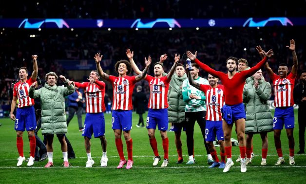 Atletico Madrid players celebrate after the match REUTERS/Juan Medina