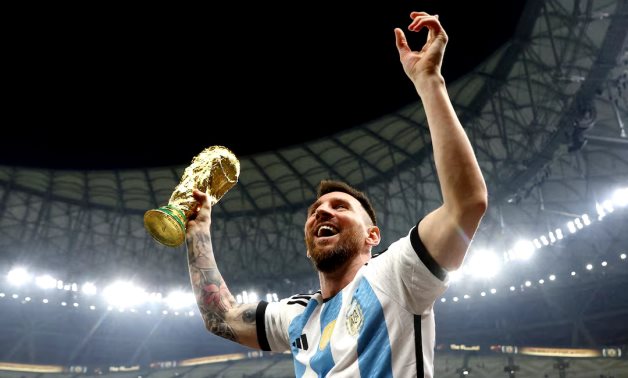 Argentina's Lionel Messi celebrates winning the World Cup with the trophy REUTERS/Hannah Mckay/File Photo