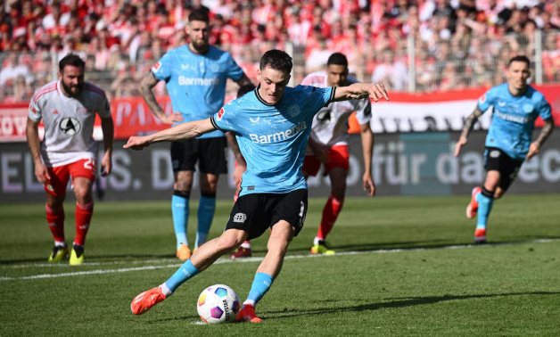 Bayer Leverkusen's Florian Wirtz scores their first goal from the penalty spot REUTERS/Annegret Hilse