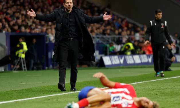Atletico Madrid coach Diego Simeone reacts as Marcos Llorente lays on the pitch REUTERS/Juan Medina