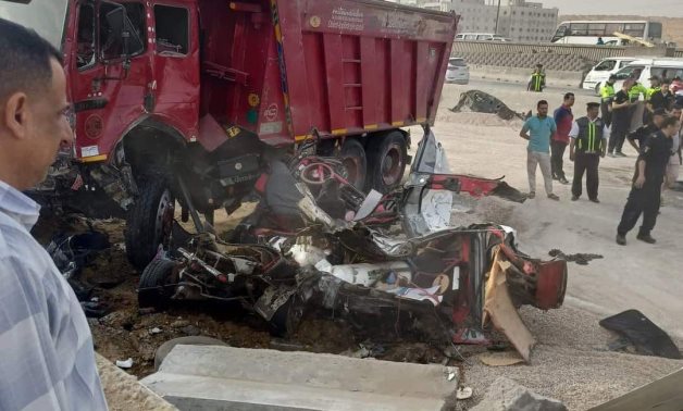 A man observes the aftermath of a truck collision involving 16 vehicles on Ring Road, which resulted in four fatalities and 11 injuries, May 11, 2024