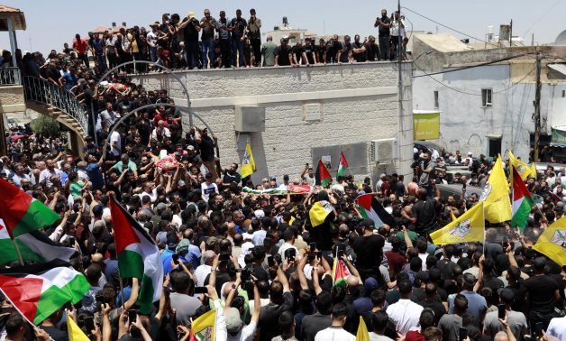 Crowds of people in Ramallah and Al-Bireh held a funeral to bid farewell for the three victims, Murshed Hamayel, Mohammed Al-Naji and Lutfi Sabri ahead of leaving them at their final resting place - WAFA