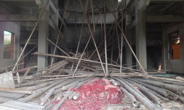 A file photo of a wooden scaffolding collapse