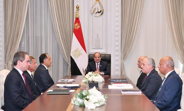 FILE - Sisi meets Madbouly, Chairman of the Supreme Council for Media Regulation Khaled Abdel Aziz, Chairman of the NPA Abdel Sadek El-Shorbagy, and Chairman of the National Media Authority Ahmed El-Moslemany 