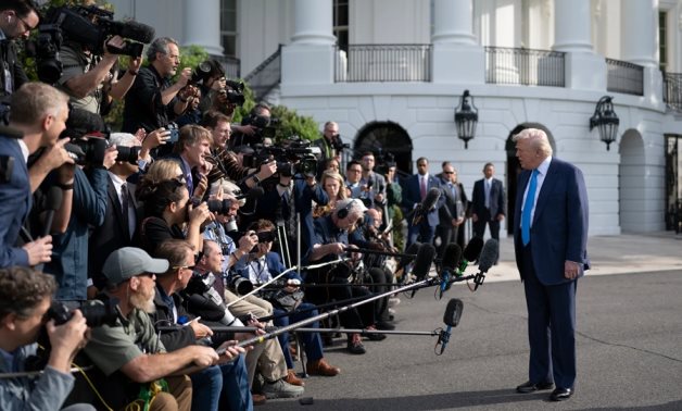 US President Donald Trump speaks to reporters at the White House. White House