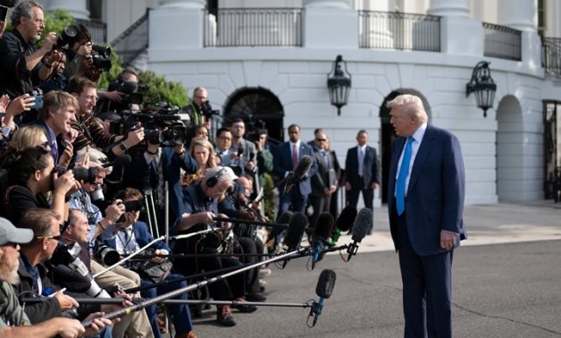 US President Donald Trump speaks to reporters at the White House. White House