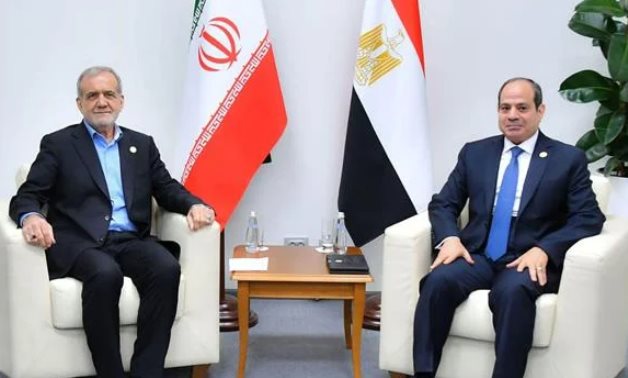 FILE - Egyptian President Abdel Fattah El-Sisi meets with Iranian President Masoud Pezeshkian on the sidelines of the BRICS summit held in Kazan, Russia, in 2024. Egyptian Presidency