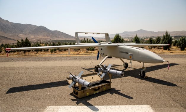 FILE - An Iranian Qods Mohajer-6 drone and two Qaem glide bombs are seen during a delivery ceremony of new equipment to the Islamic Revolutionary Guard Corps Ground Force. Fars News/Hadi Hirbodvash