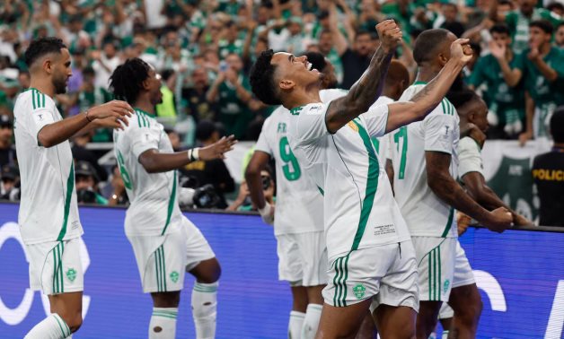 Al Ahli's Galeno celebrates with teammates after Feras Al-Brikan scores their first goal REUTERS/Ibraheem Abu Mustafa 