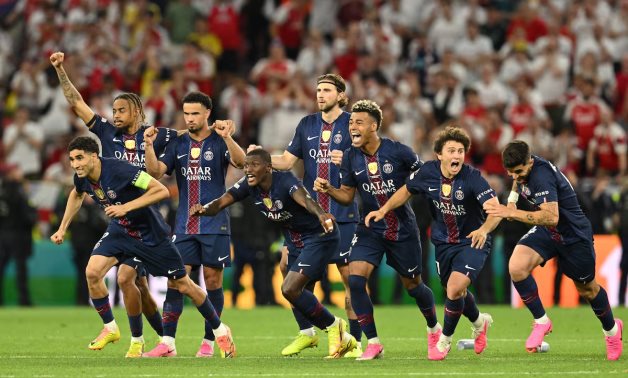 Paris St Germain players celebrate after winning the UEFA Champions League REUTERS/Angelika Warmuth 