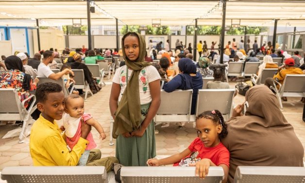 File photo: Sudanese refugee children and their mother register at UNHCR Egypt after the fleeing conflict in Sudan. UNHCR/Pedro Costa Gomes