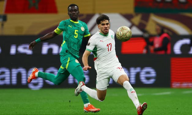Morocco's Abde Ezzalzouli in action with Senegal's Idrissa Gueye REUTERS/Siphiwe Sibeko