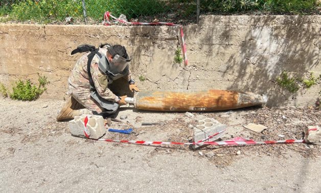 A specialized Lebanese Army unit dismantles an unexploded aerial bomb left behind by Israeli attacks in southern Lebanon. Lebanese Army