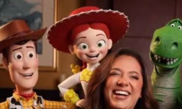 Rahma Ahmed with Toy Story characters.