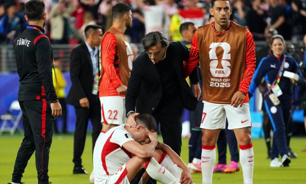  Turkey coach Vincenzo Montella with a dejected Merih Demiral after the match IMAGN IMAGES via Reuters/David Gonzales 