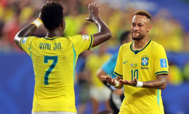 Brazil's Neymar Jr. celebrates after the match with Vinicius Junior IMAGN IMAGES via Reuters/Sam Navarro