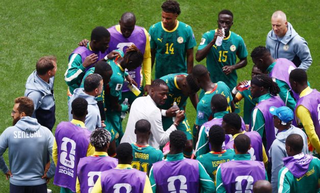 Senegal coach Pape Thiaw gives instructions to players during a hydration break REUTERS/Lee Smith 