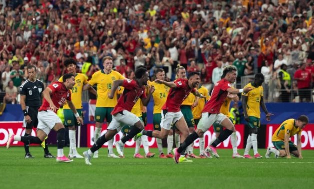 Egypt's players celebrate after Hossam Abdel Meguid converted the decisive penalty to send the Pharaohs into the FIFA World Cup last 16 for the first time in their history. Egyptian National Team