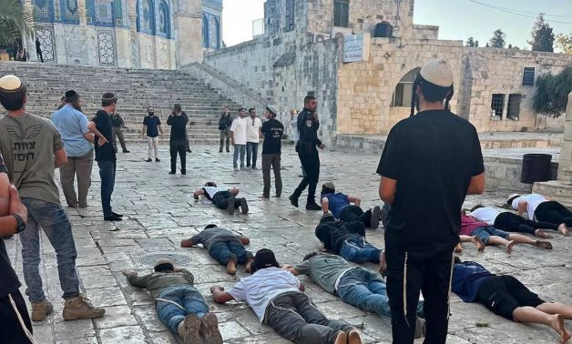 Dozens of settlers carry out what is known as "epic prostration" near the Dome of the Rock as Knesset members and thousands of Israelis storm Al-Aqsa Mosque on 23 July 2026. Palestinian news agency WAFA