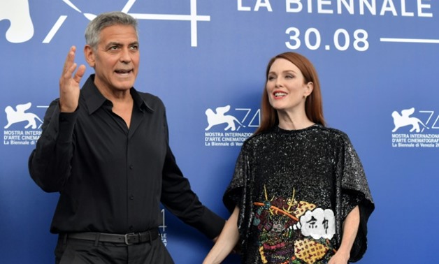 Hollywood stars George Clooney and Julianne Moore waded into the US row over Confederate symbols as they attended the Venice Film Festival where they promoted Clooney's 'Durbicon' in which Moore stars.

