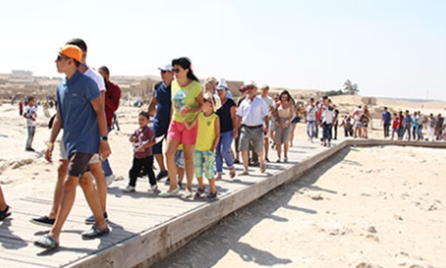 Visitors walking a corridor at the site of the Pyramids on the second day of eid al-Adha, September 2, 2107 - Archive