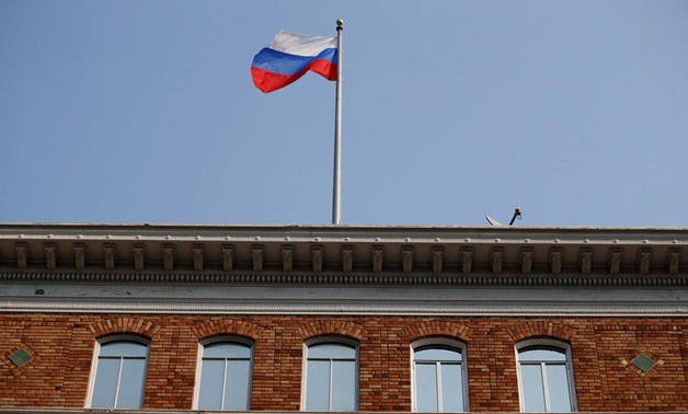 The Russian flag waves in the wind on the rooftop of the Consulate General of Russia in San Francisco, California, U.S., September 2, 2017. REUTERS/Stephen Lam